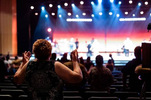 Audience applauding a stage performance