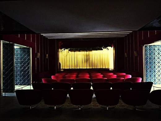 Rows of empty theater seats